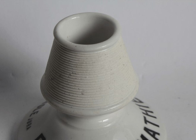 Pyrogène publicitaire en porcelaine, « Prunelle Mathieu », Champagnole (annonce eBay archivée).