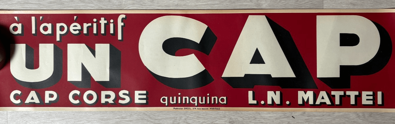 Plaque ou affiche publicitaire « À l'apéritif, UN CAP » (annonce eBay archivée).